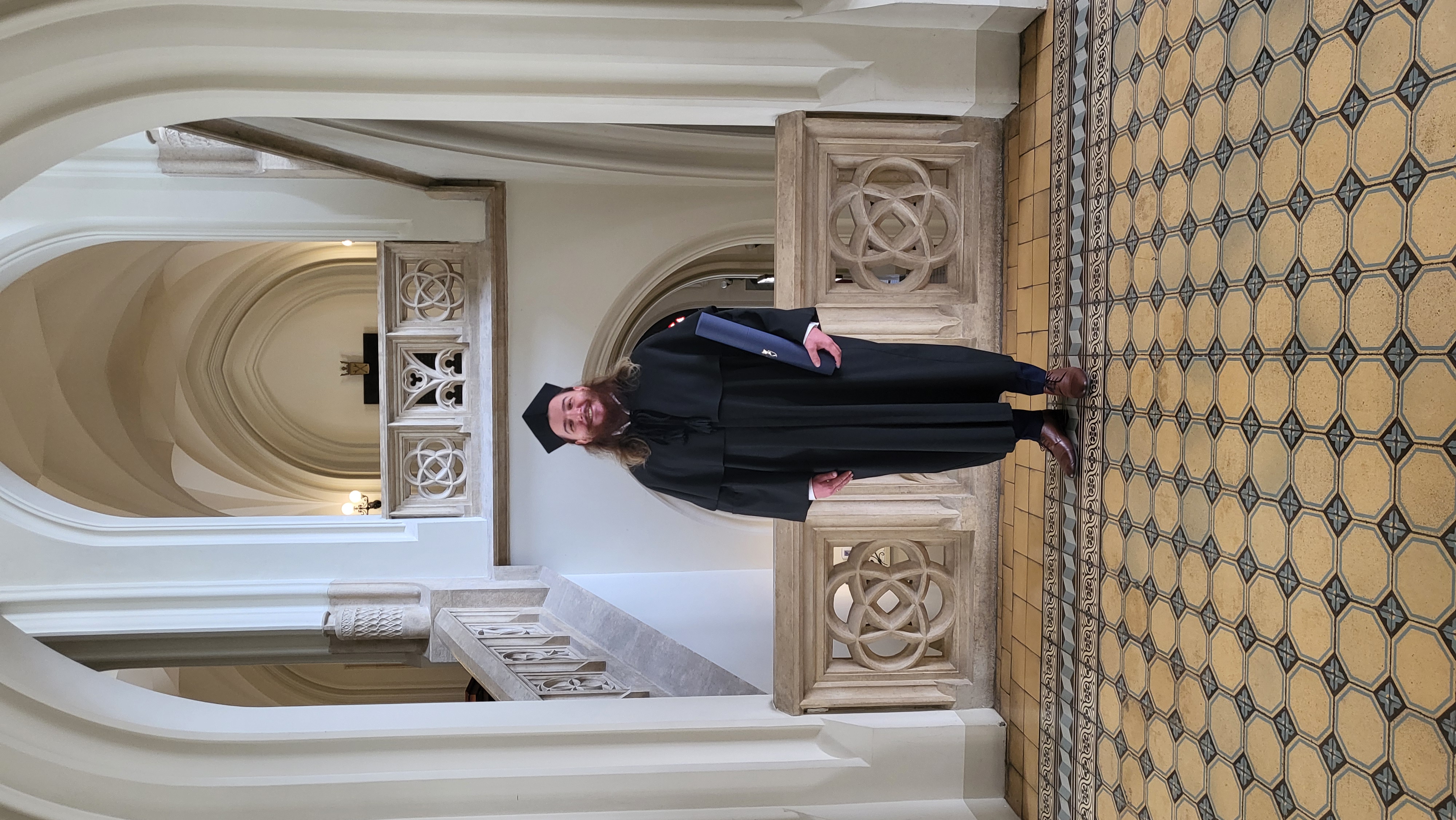 Portrait of Dr Tomasz-Łukasz Stanowski in academic gown